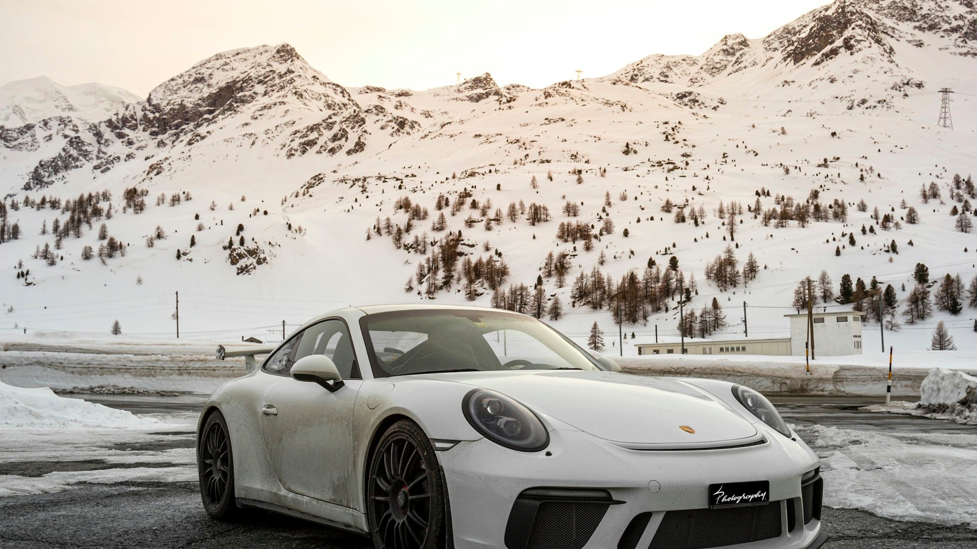 White Porsche 911 GT3 in the Swiss Alps