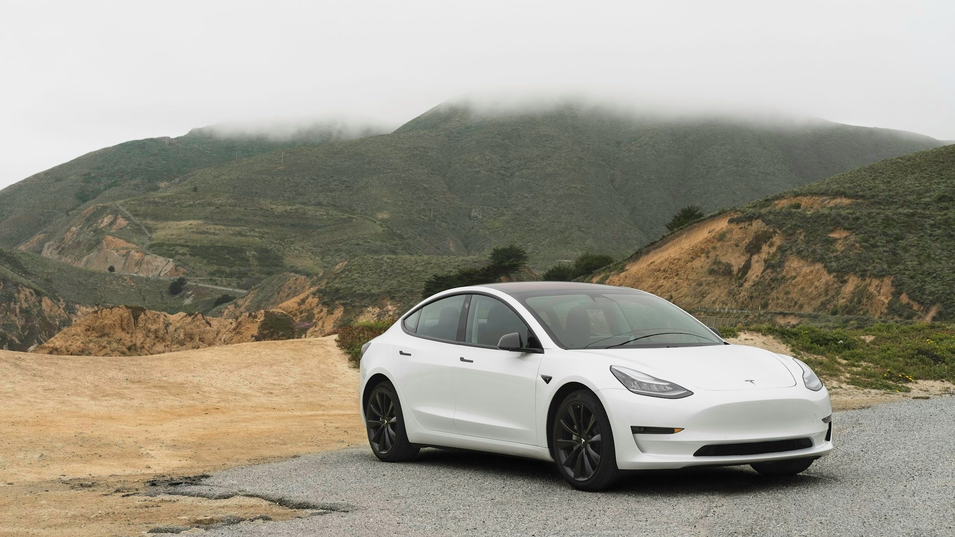 White Tesla Model 3 on the California coast